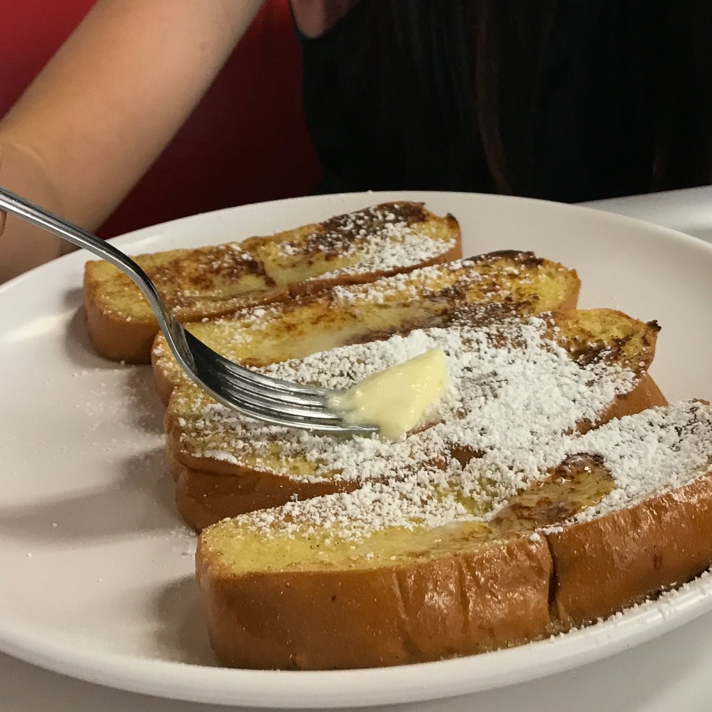 A breakfast sandwich on toast.