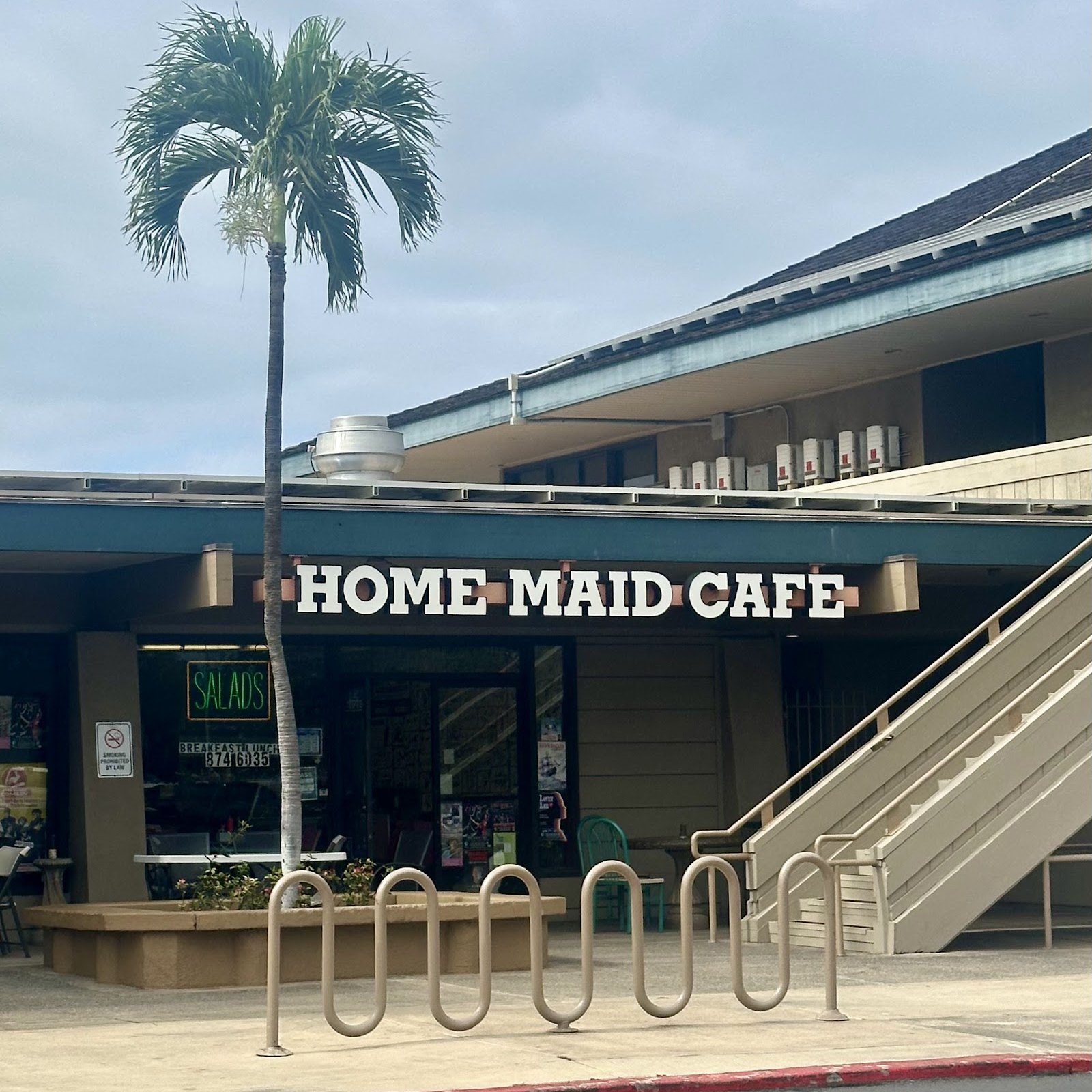 The hand-lettered Home Maid Cafe storefront sign.