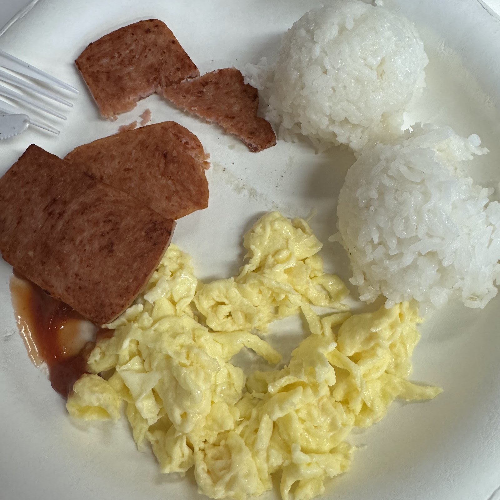Fried rice and eggs breakfast plate.